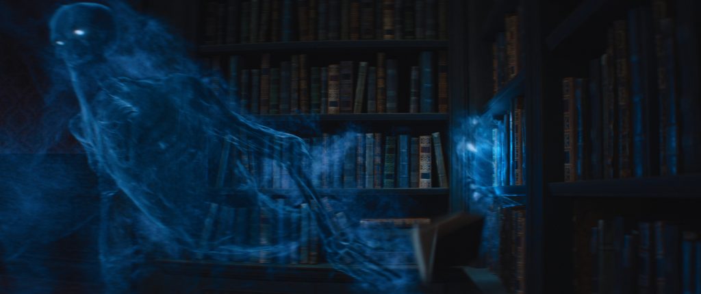 A CG ghost moves through the Mansion’s library.