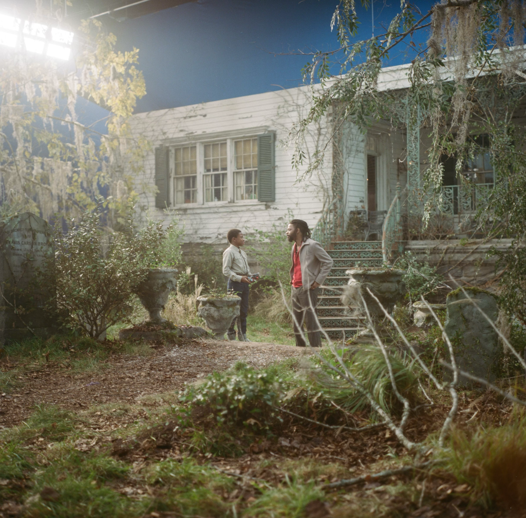 Actors Chase Dillon (left) and LaKeith Stanfield onset behind the first-floor exterior of the Mansion.
