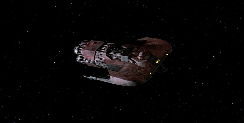 The Merchantman starship flies through space in Star Trek III.