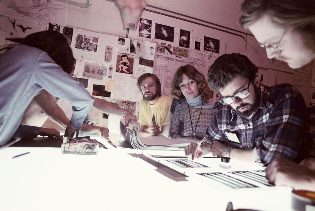 George Lucas reviews a visual effects shot with ILM crew during production of Star Wars: A New Hope.